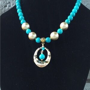 Blue and Gold Necklace with Ornate Pendant